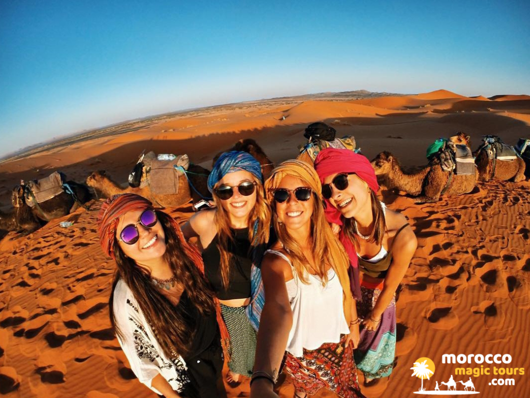 Friends sharing a selfie during an unforgettable trip to Sahara Desert