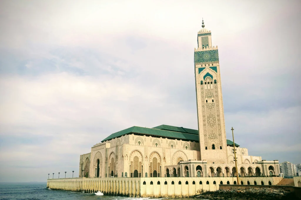 The Hassan II Mosque rising above the Atlantic Ocean in Casablanca, the starting point of our ultimate 10 days tour from Casablanca.