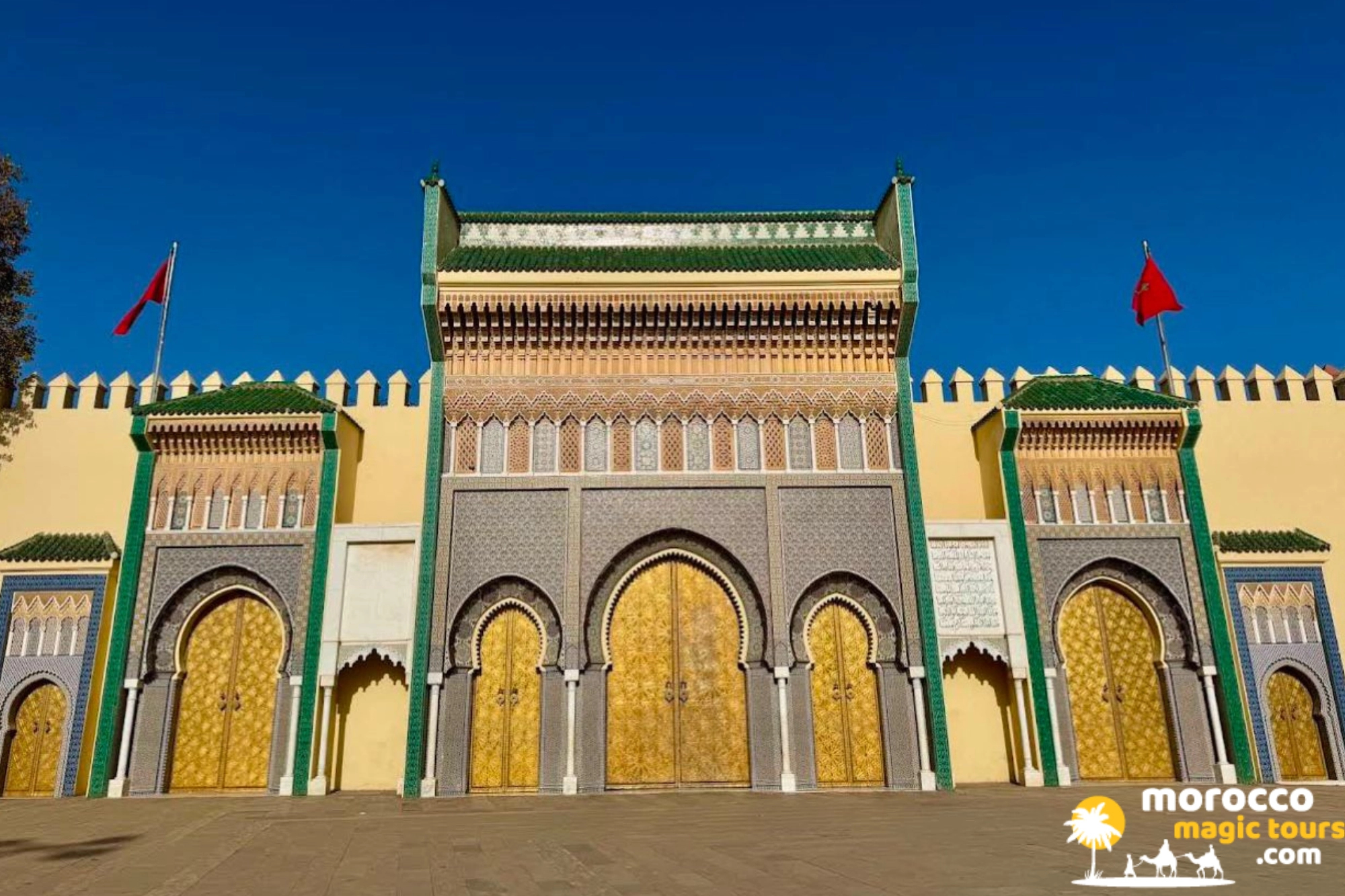 Golden brass doors and intricate mosaic zellij tilework at the Royal Palace entrance in Fes on a 6 days Sahara desert tour from Tangier