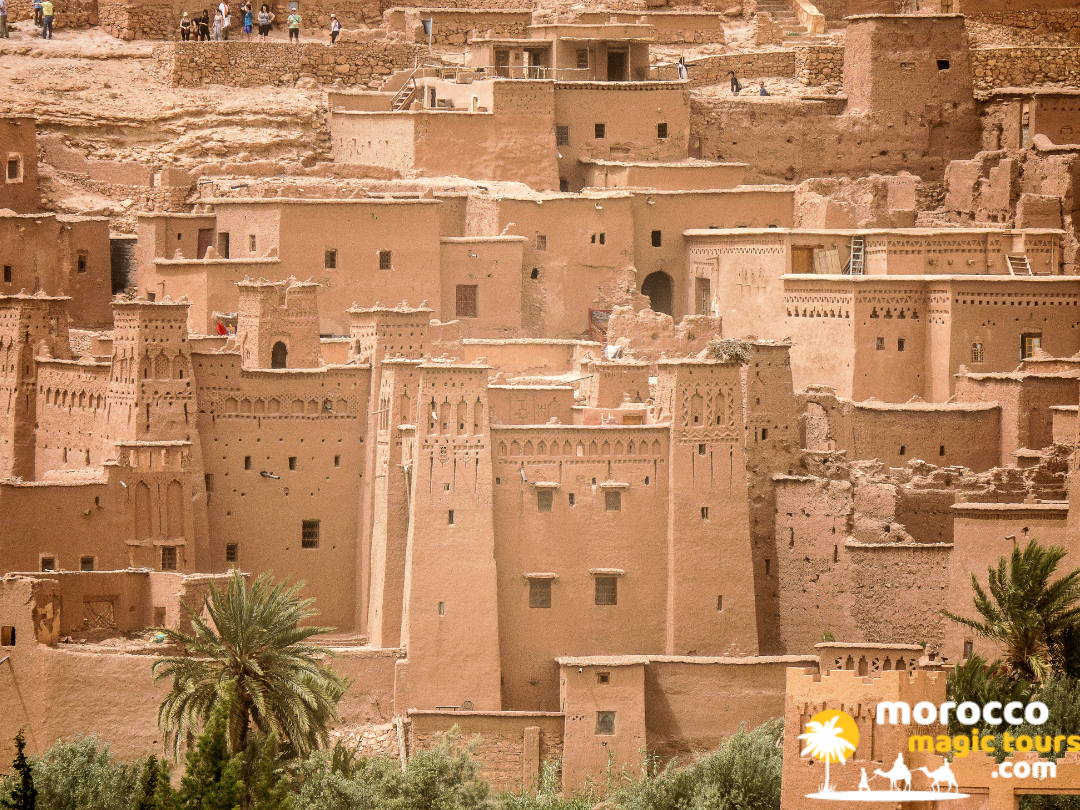 Detailed view of traditional geometric patterns carved into the mud-brick towers of a southern Moroccan kasbah.