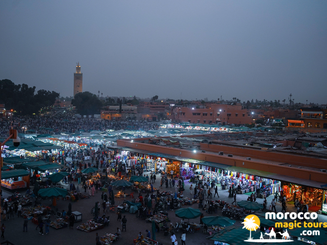 Busy Jemaa el-Fnaa market square illuminated at dusk on 9 day itinerary morocco