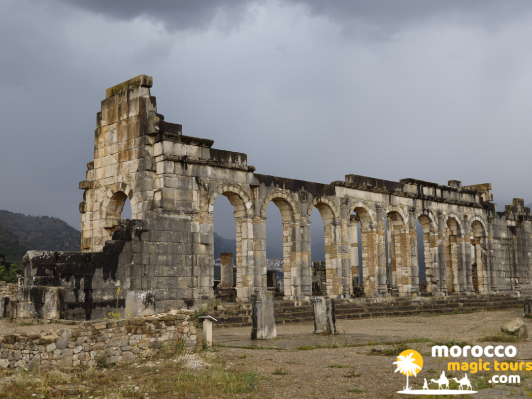 Ancient stone arches at Volubilis Roman ruins on a 9 day morocco itinerary
