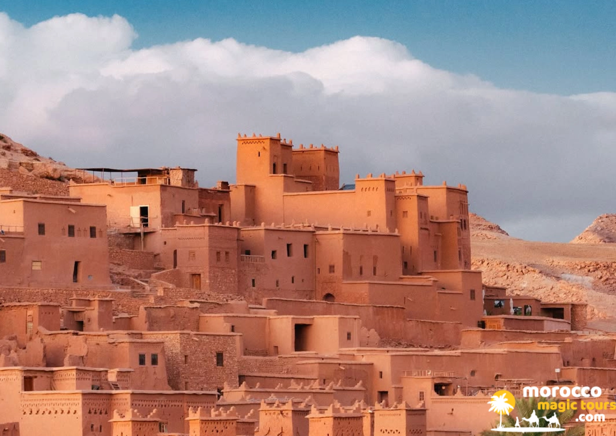 8 days tour from Casablanca to Kasbah Ait Ben Haddou magnificent clay structures under a blue sky.