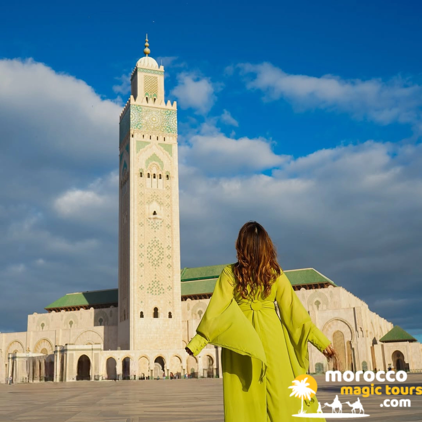 Traveler admiring the Hassan II Mosque minaret in Casablanca, a stop on the marrakech desert tour 12 days