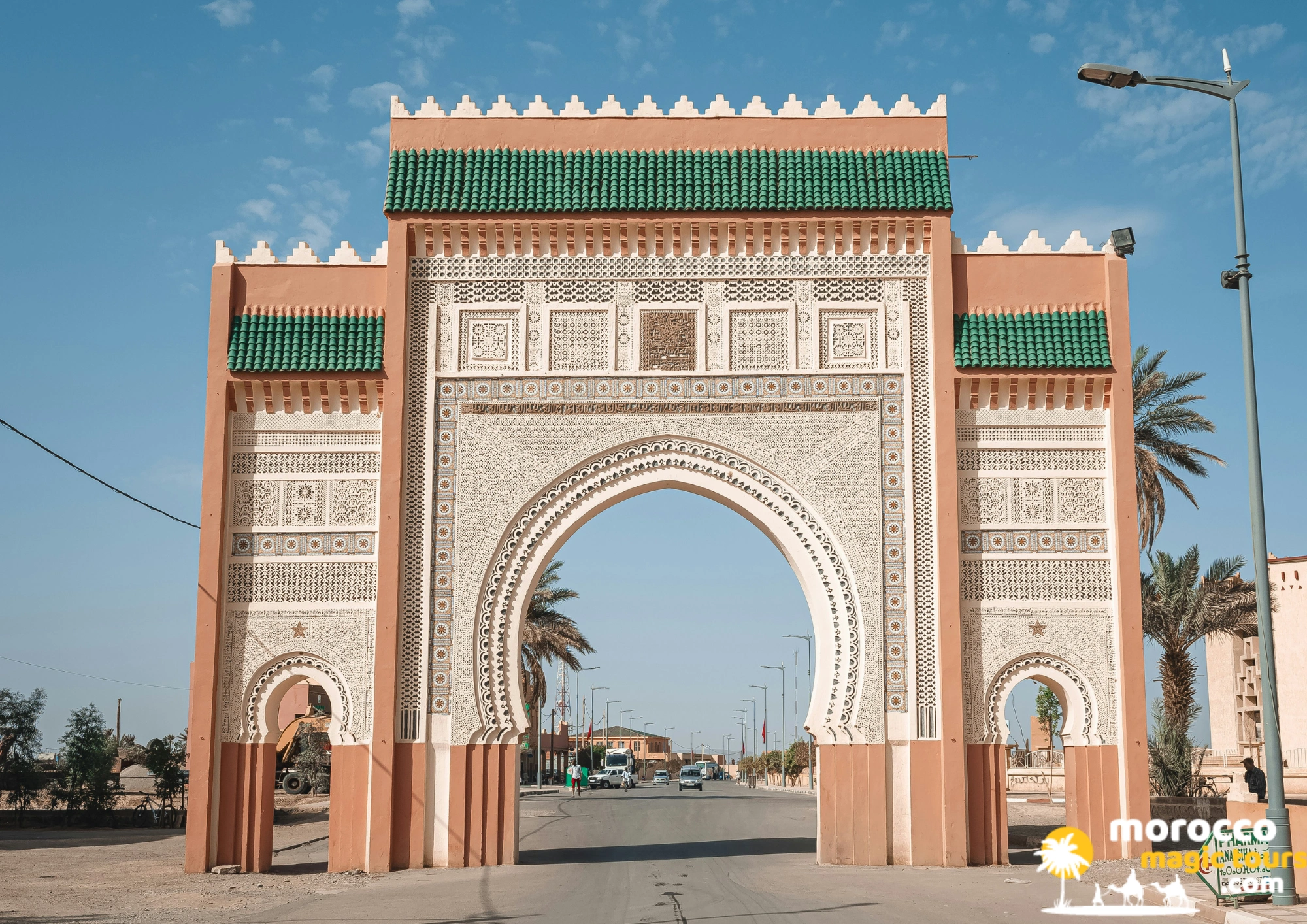 The big traditional clay archway of the Rissani city gate in clear blue sky during an 8 days from Casablanca tour.