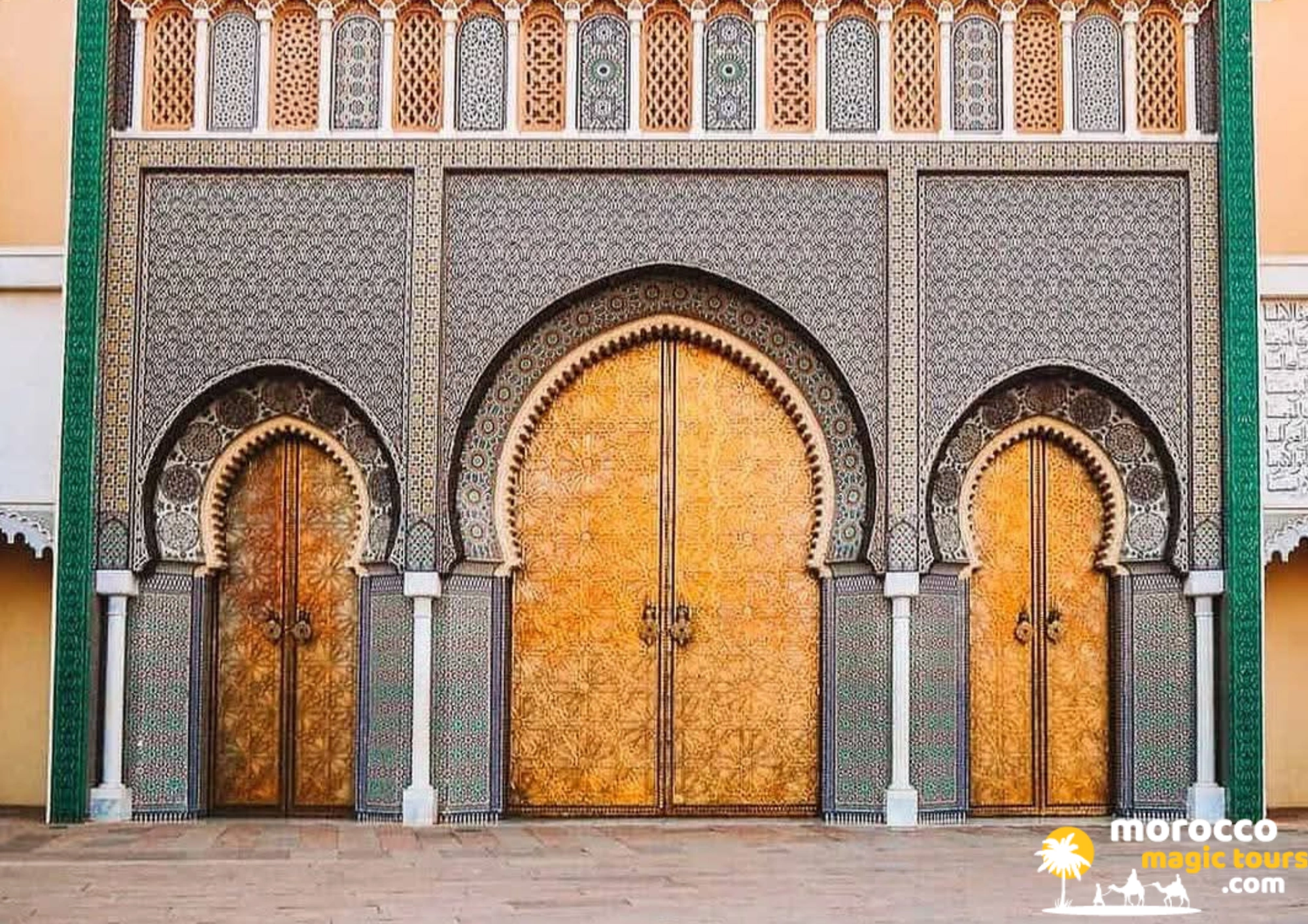 The Royal Palace in Fes with its magnificent intricately carved golden brass doors and traditional mosaic tilework.