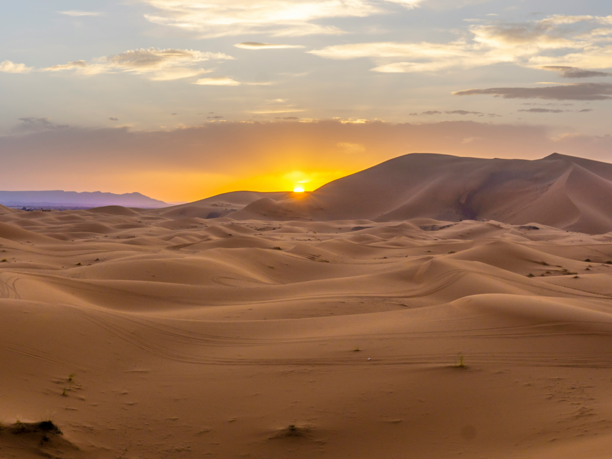 Sunrise over the dunes of Erg Chebbi during a camel ride Merzouga for sunrise excursion